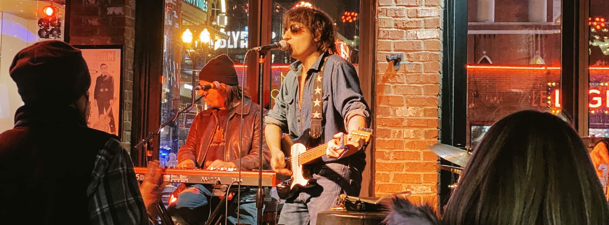 bar singer on guitar in Cedar Rapids