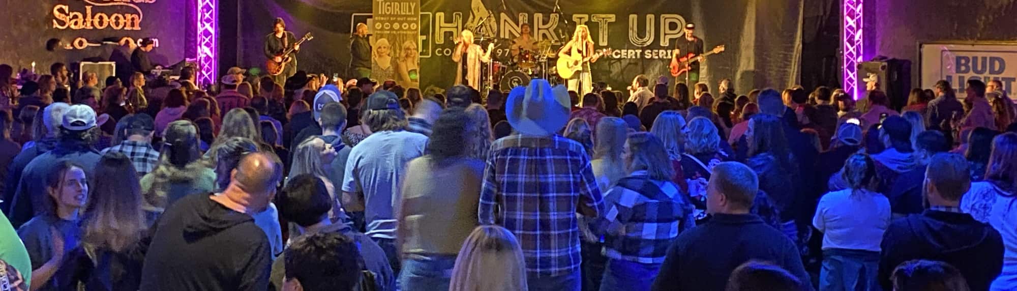 country concert with fans wearing cowboy hats Cedar Rapids